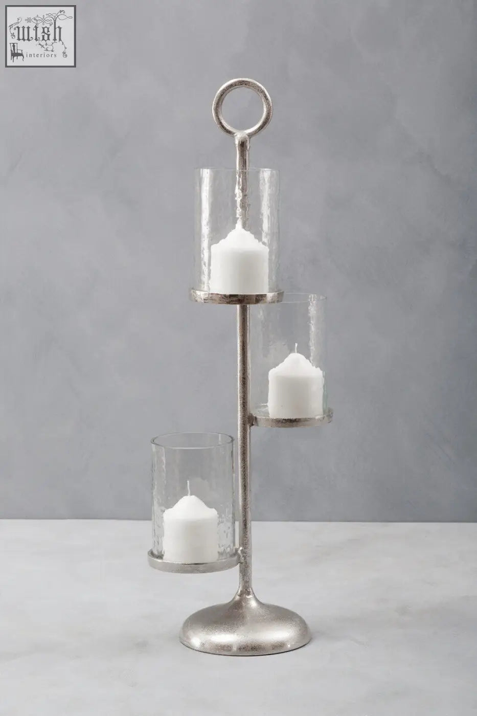 Silver-toned verve floor standing 3-light candle holder with three tiers clear glass cylinders and white candles