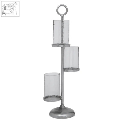 Silver-toned verve floor standing 3-light candle holder with three clear glass cylinders on a tiered metal stand