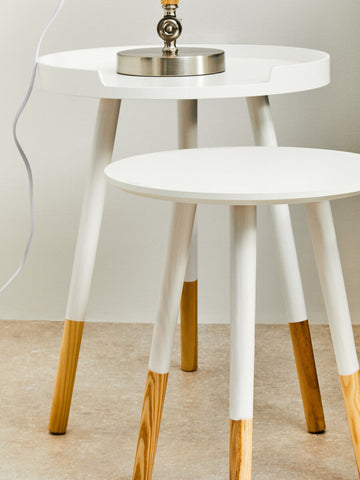 Viborg set of two white round nesting side tables with tapered legs and metallic lamp bases on top
