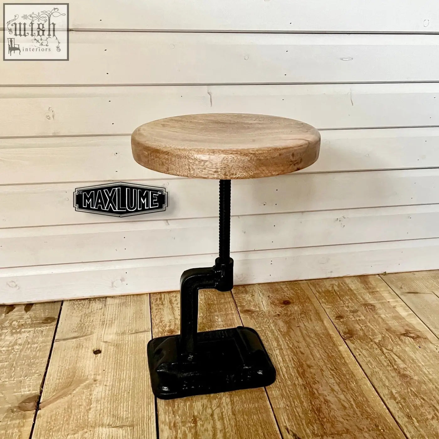 Rustic vice clamp industrial bar stool with light wood seat and black cast iron adjustable height base