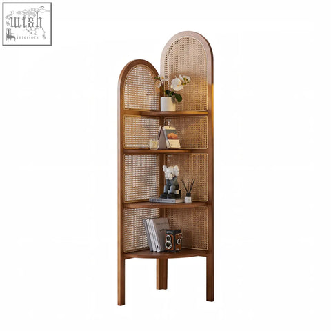 A tall vicente triangle bookshelf with warm ash wood frame and woven rattan cane panels for corner storage