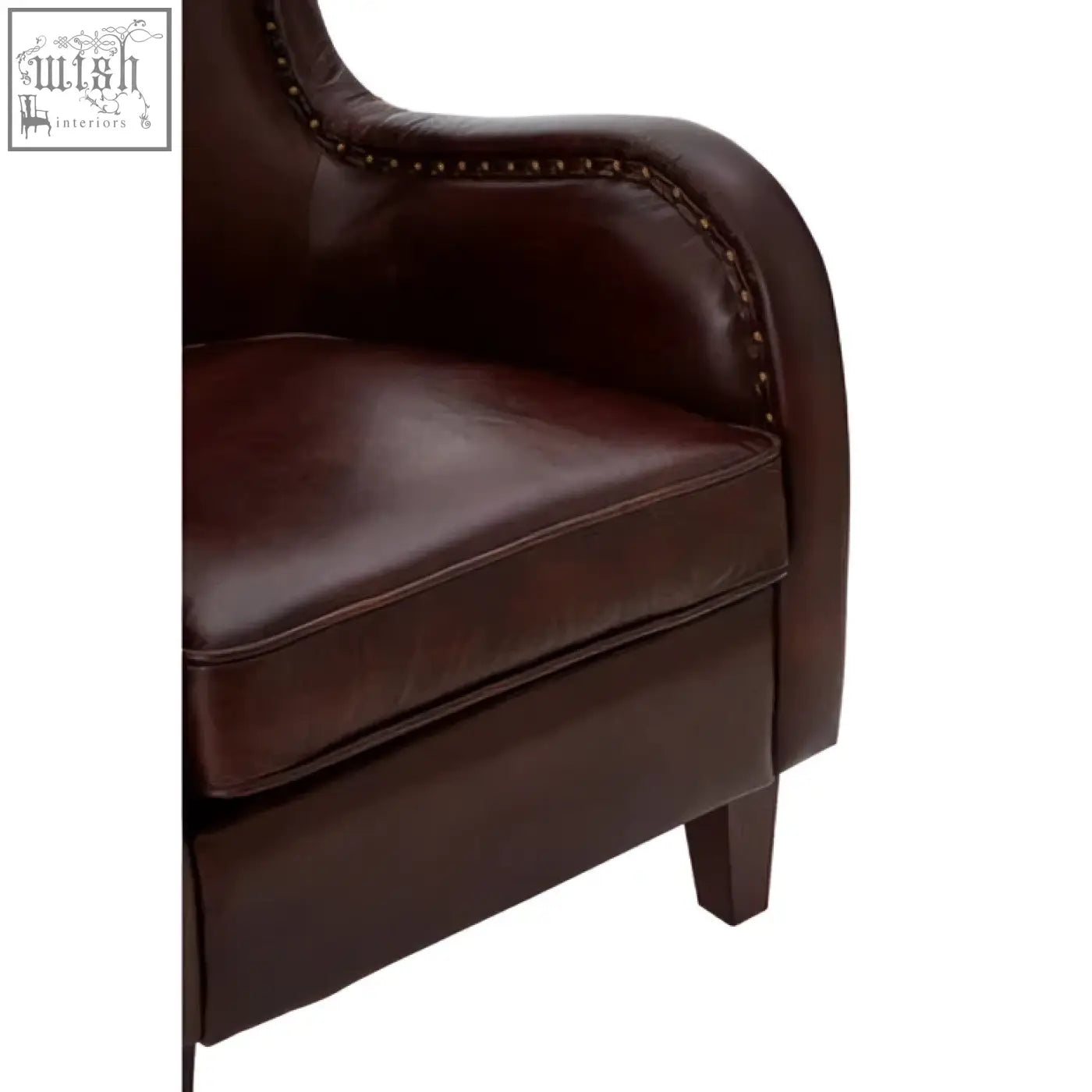 Dark brown leather victor lounge chair with stitched detailing and walnut wood legs for stylish comfort