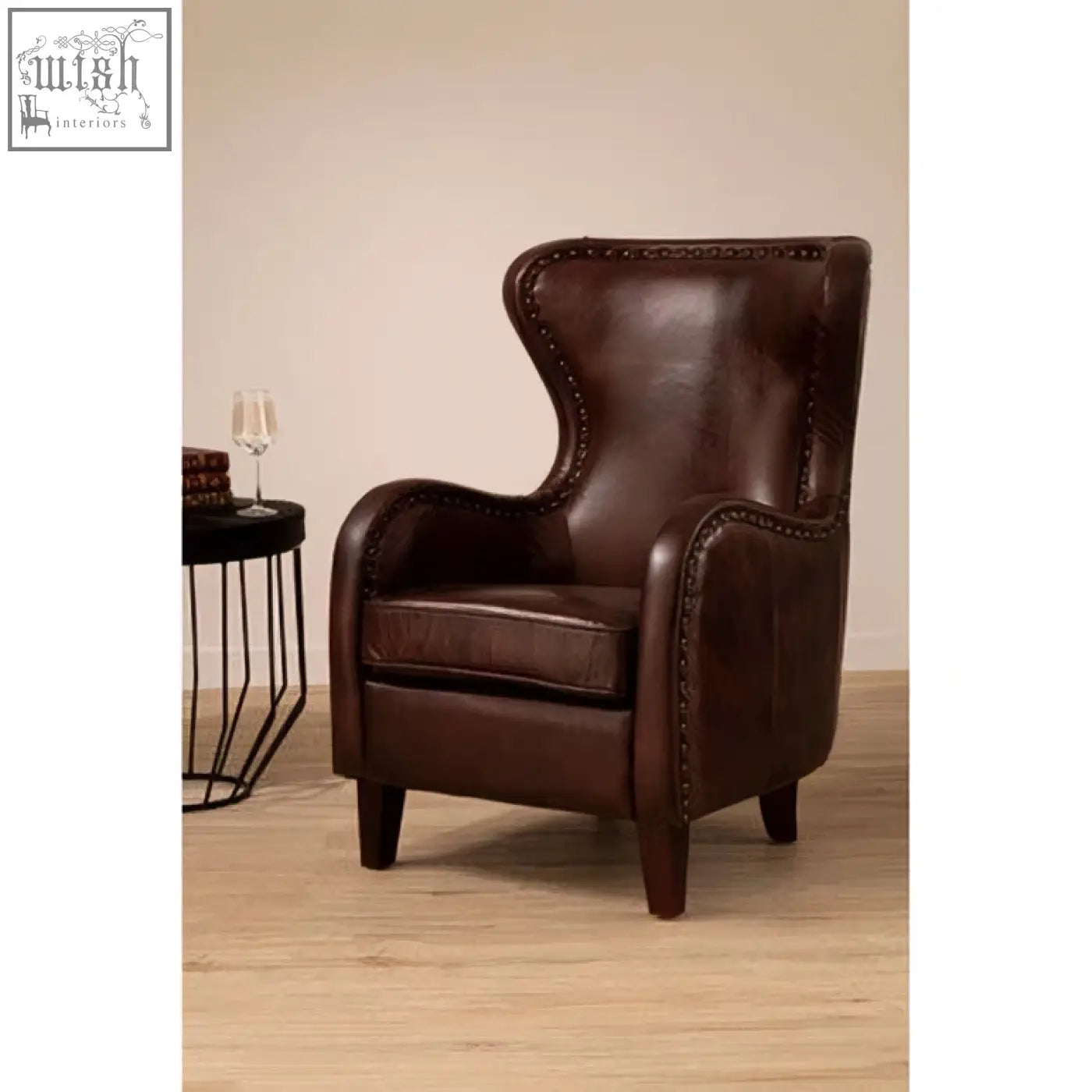 Victor brown leather lounge chair with stitched detailing and walnut wood legs perfect for cozy seating