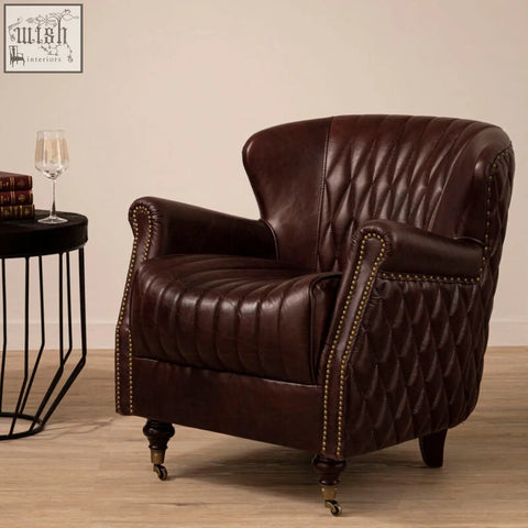 Rich brown leather victor brown leather winged back armchair with quilted stitching and curved arms