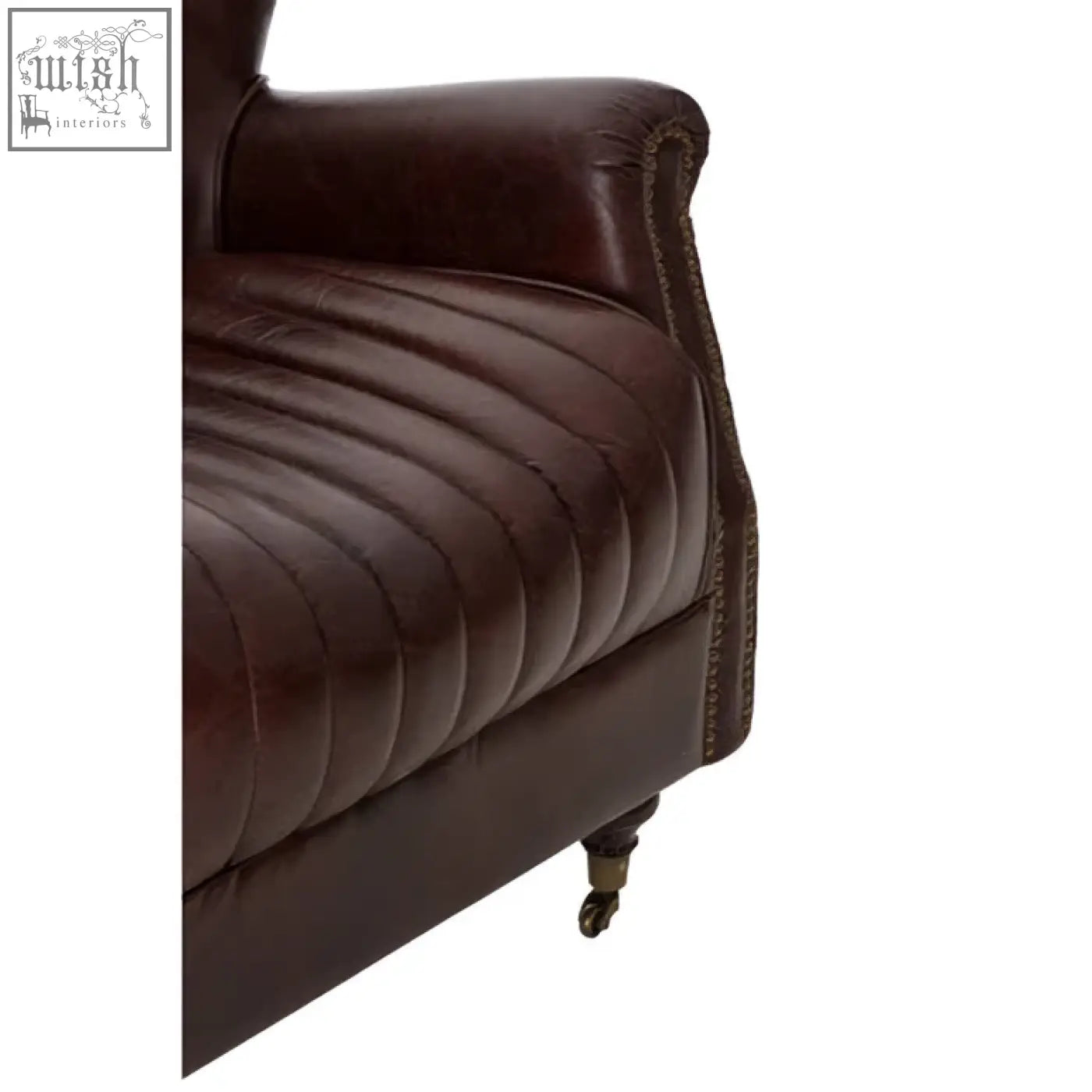 Victor brown leather winged back armchair with tufted upholstery curved arms and decorative nailhead trim