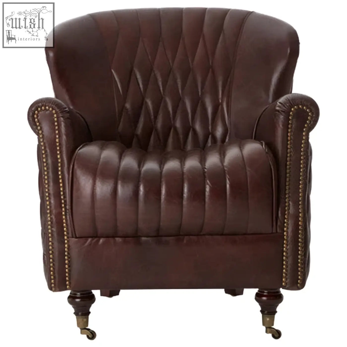Victor brown leather winged back armchair with diamond-quilted back, curved arms, brass nailhead trim, and casters