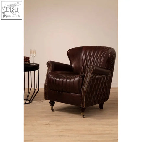 Victor brown leather winged back armchair with tufted upholstery curved arms and nailhead trim in brown leather