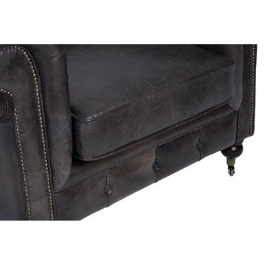 Dark gray faux leather victor chesterfield armchair with tufted detailing and nailhead trim for stylish seating