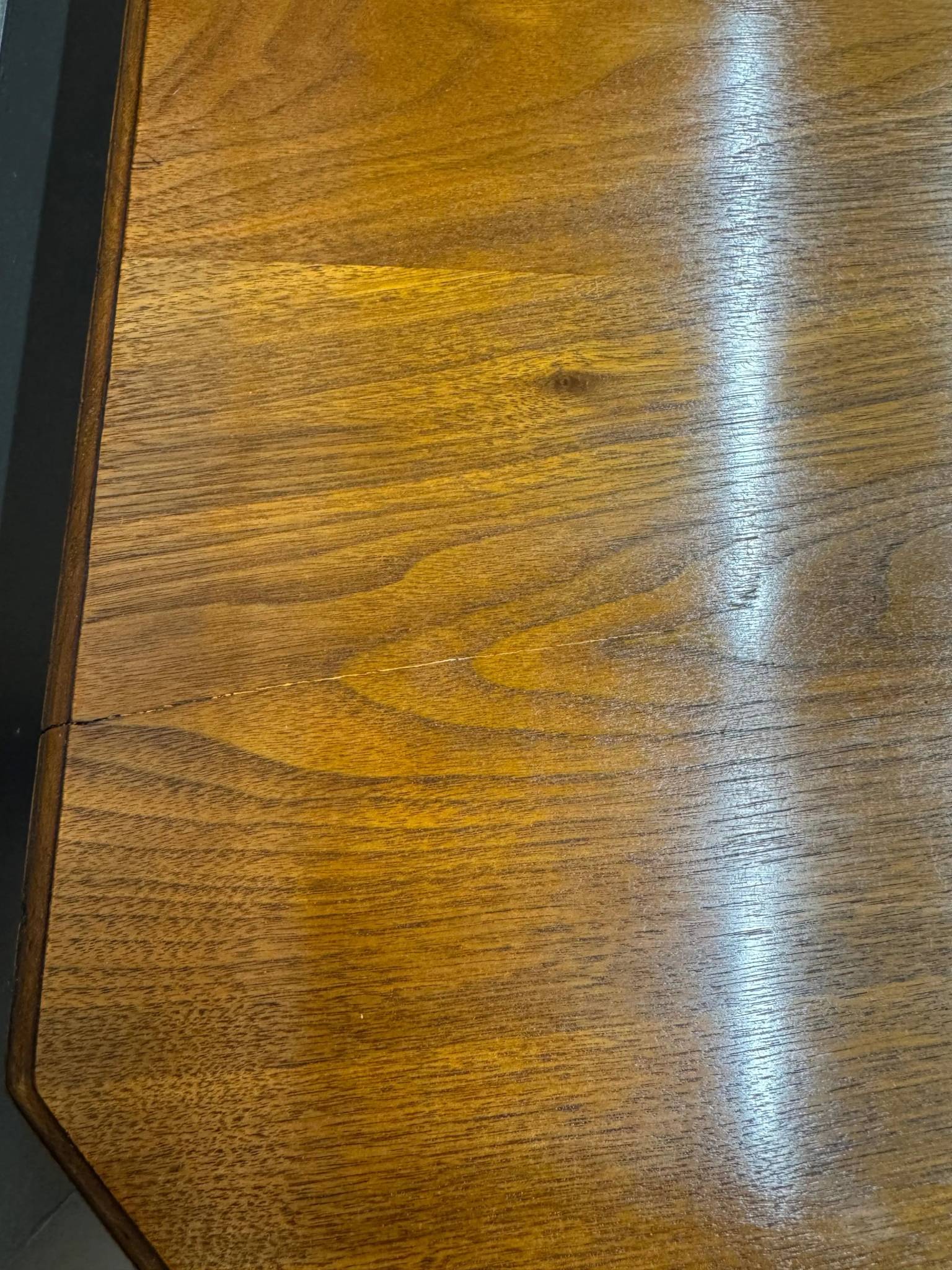 Rich warm-toned victorian solid walnut extending dining table with natural grain seating 8 to 10 people