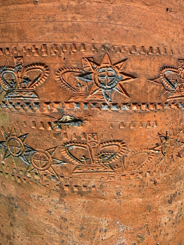 Victorian terracotta chimney pot with intricate crown and sun patterns in earthy orange perfect as garden planter