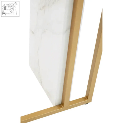 Gold-toned metal frame supporting a white marble slab on vieste white marble effect console table