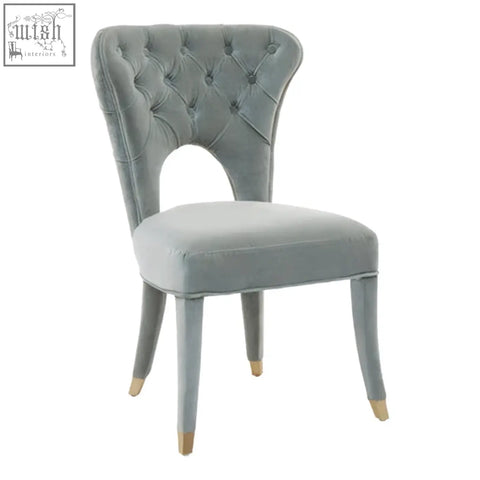 Light gray velvet tufted dining chair with gold tipped legs perfect alternative to blue velvet tufted style