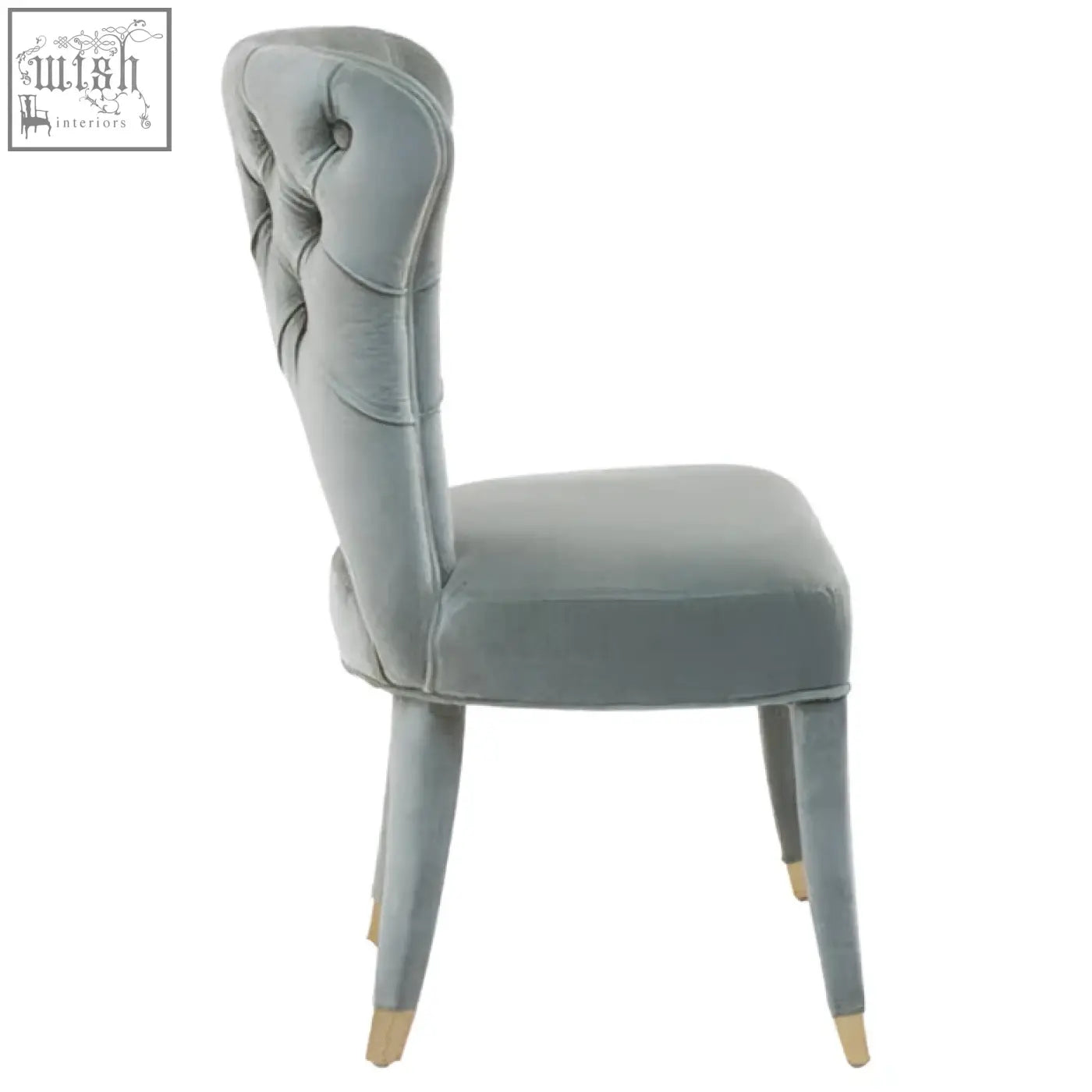 A sleek light gray velvet tufted dining chair with gold-toned legs perfect for velvet tufted dining setups