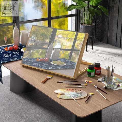 Wooden beechwood table easel with adjustable angle and portable folding design holding framed yellow green painting