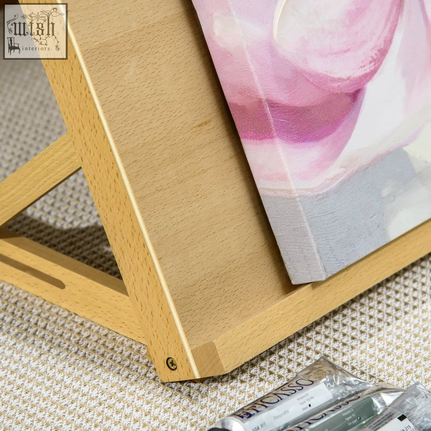 Light wood vinsetto beechwood table easel with adjustable angle holding pink and gray abstract painting portable folding
