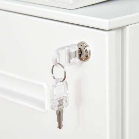 Transparent plastic key with metal blade inserted into lock of white vinsetto metal filing cabinet for home office use