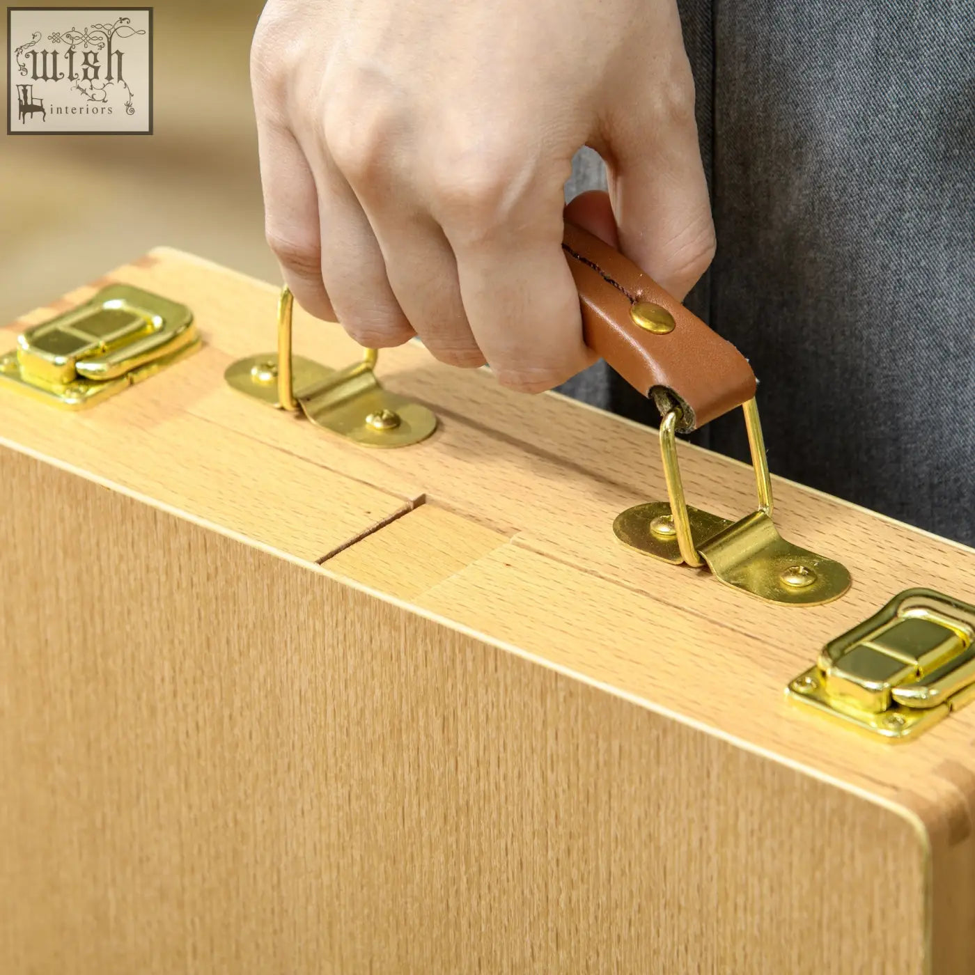 Light-colored wooden table easel box with brass latches and leather handle portable adjustable beechwood easel box