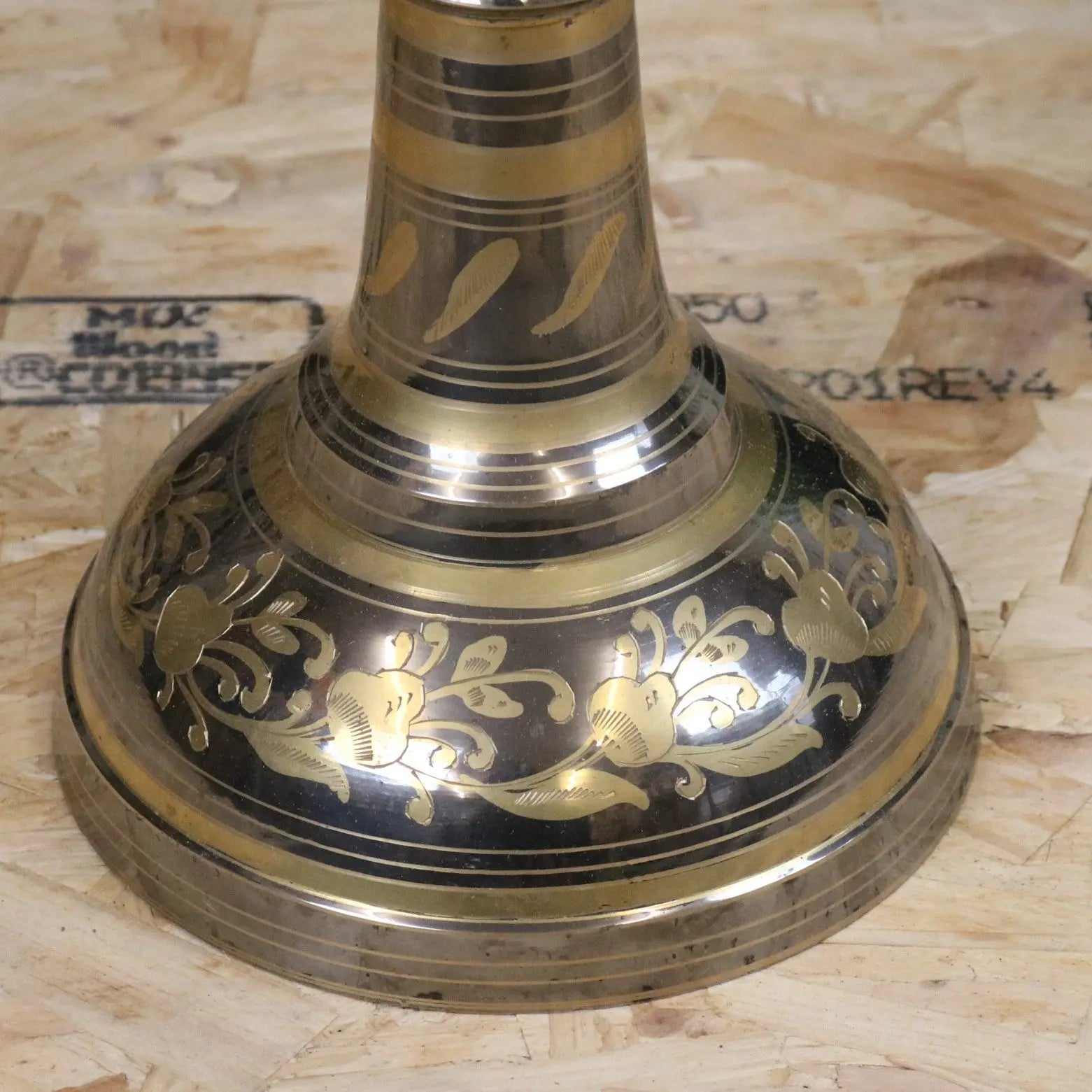 Vintage large brass vase with intricate gold floral engravings and polished silver and gold surface