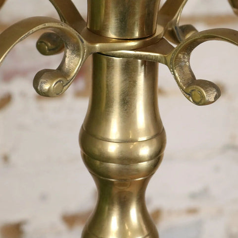 Vintage brass candelabra with ornate curved arms and polished reflective surface holding five candles at 100cm tall
