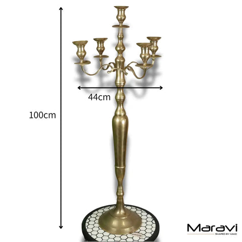 A tall vintage brass candelabra with five ornate arms and a hexagonal mosaic base perfect for elegant decor