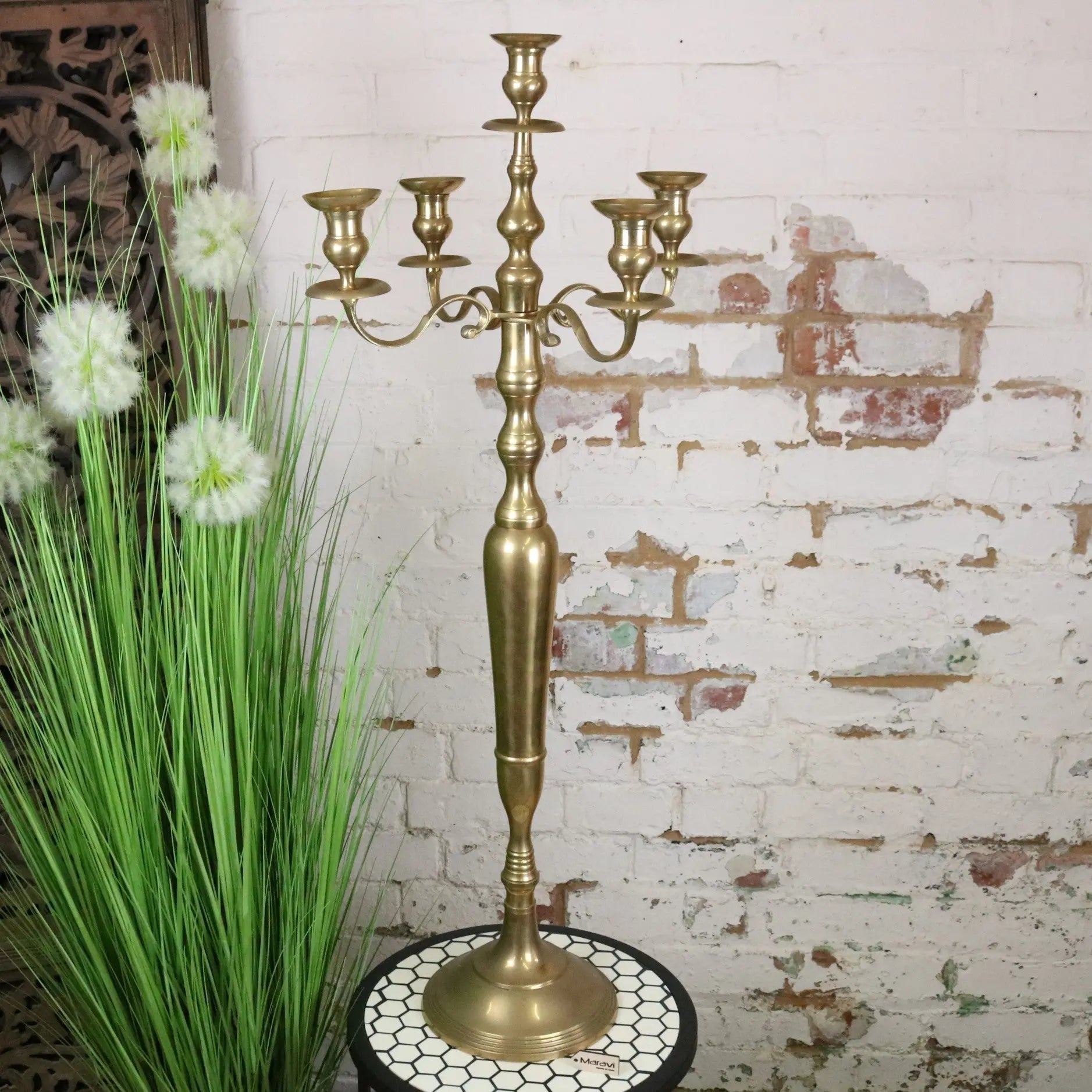 Vintage brass candelabra 100cm tall with five elegantly curved arms and a decorative base in brass finish