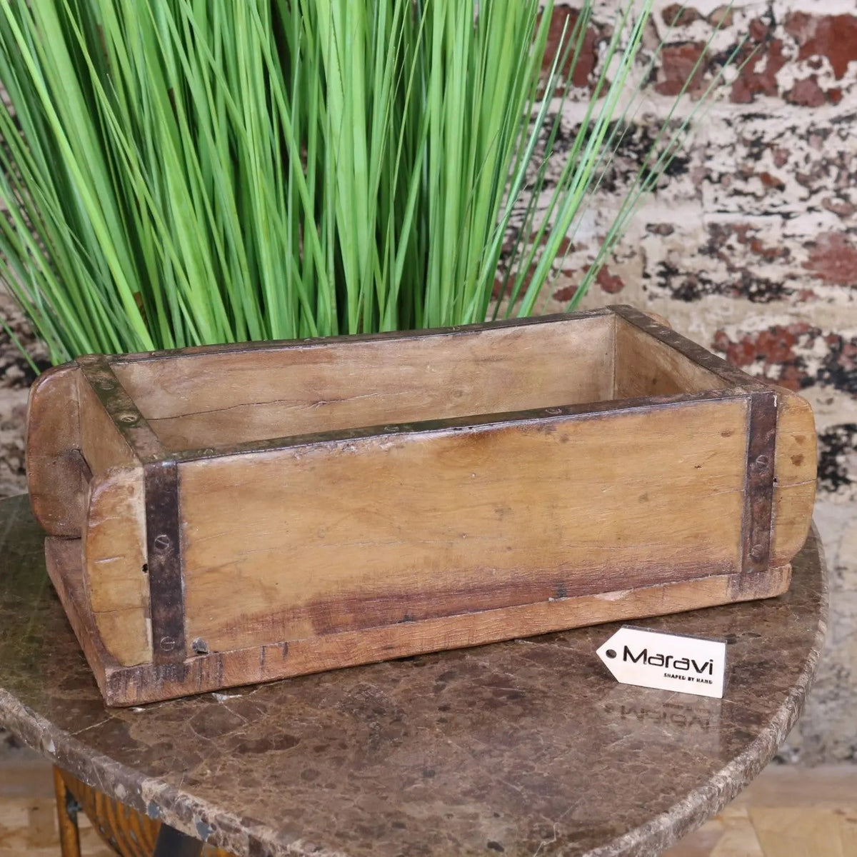 Vintage brick mould wooden rustic loaf mold with weathered wood and dark metal reinforcements for bread baking