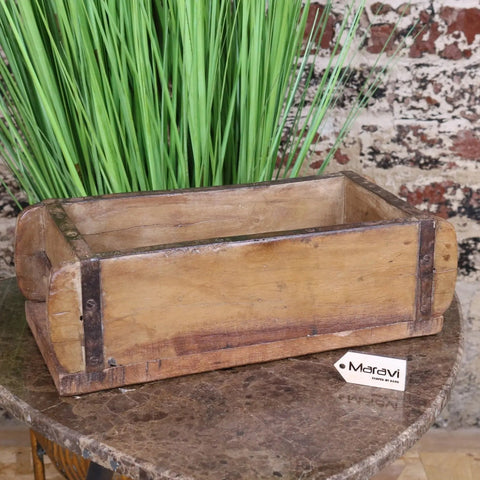 Vintage brick mould wooden rustic loaf mold with weathered wood and dark metal reinforcements for bread baking