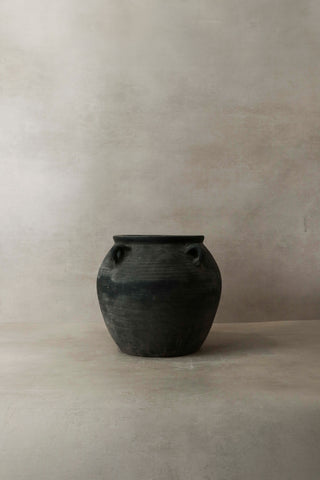 Vintage dark ceramic jar with two small handles on either side perfect for rustic home decor