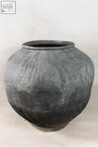 Vintage dark pot xl nº 7 with a dark gray textured ceramic body, ribbed patterns, flared rim, and unglazed exterior by village potter
