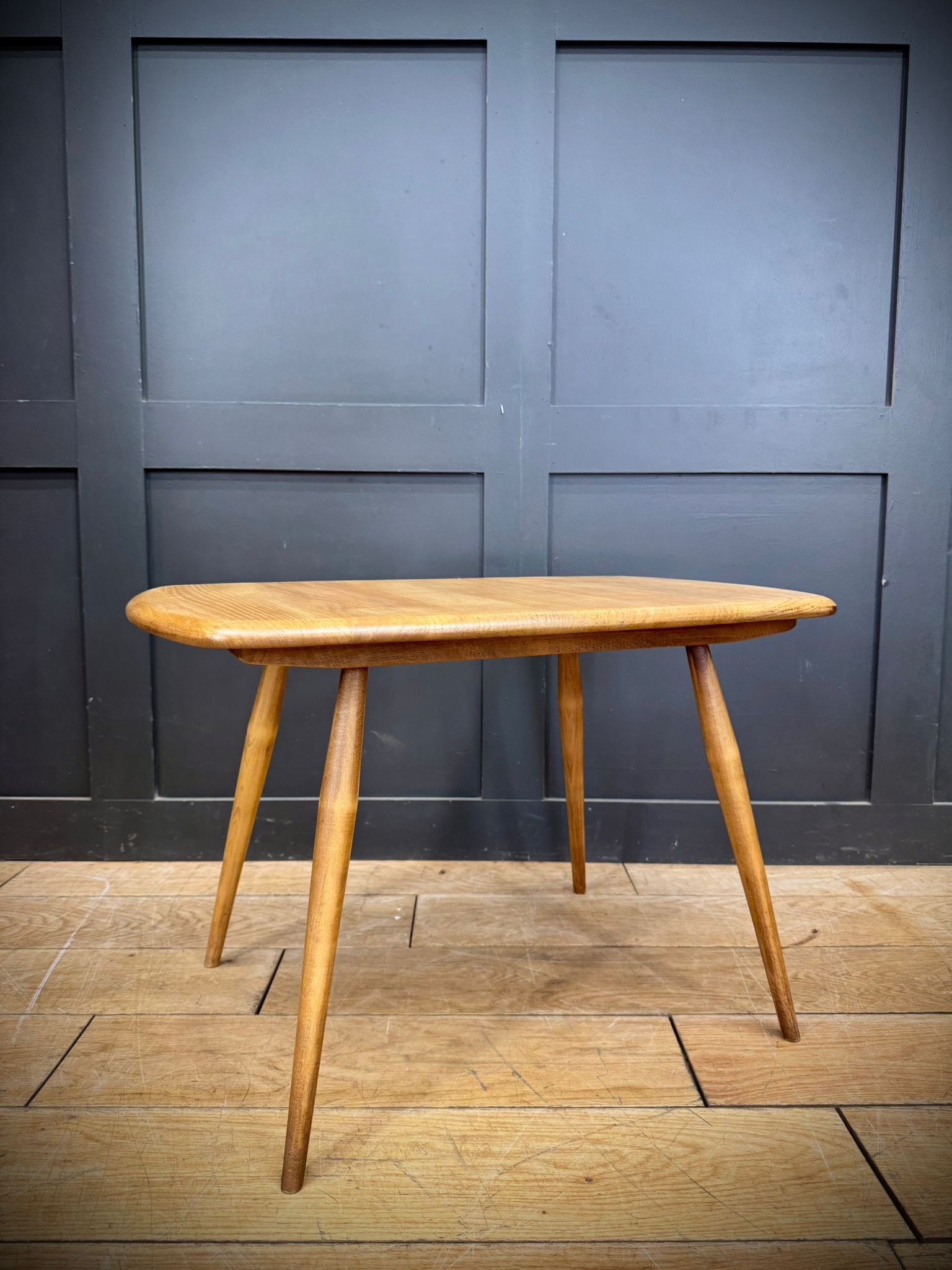 Vintage ercol model 213 coffee table in blonde elm with smooth oval top and tapered legs professionally laser stripped