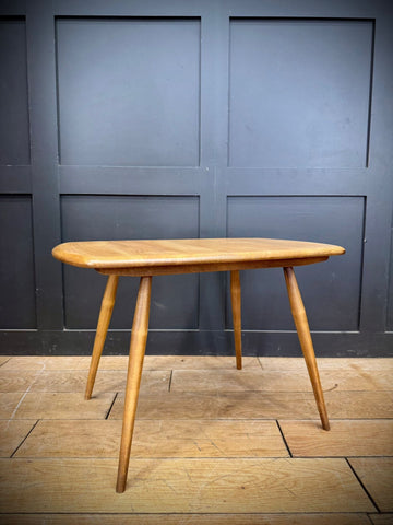 Vintage ercol model 213 coffee table in blonde elm with smooth oval top and tapered legs professionally laser stripped