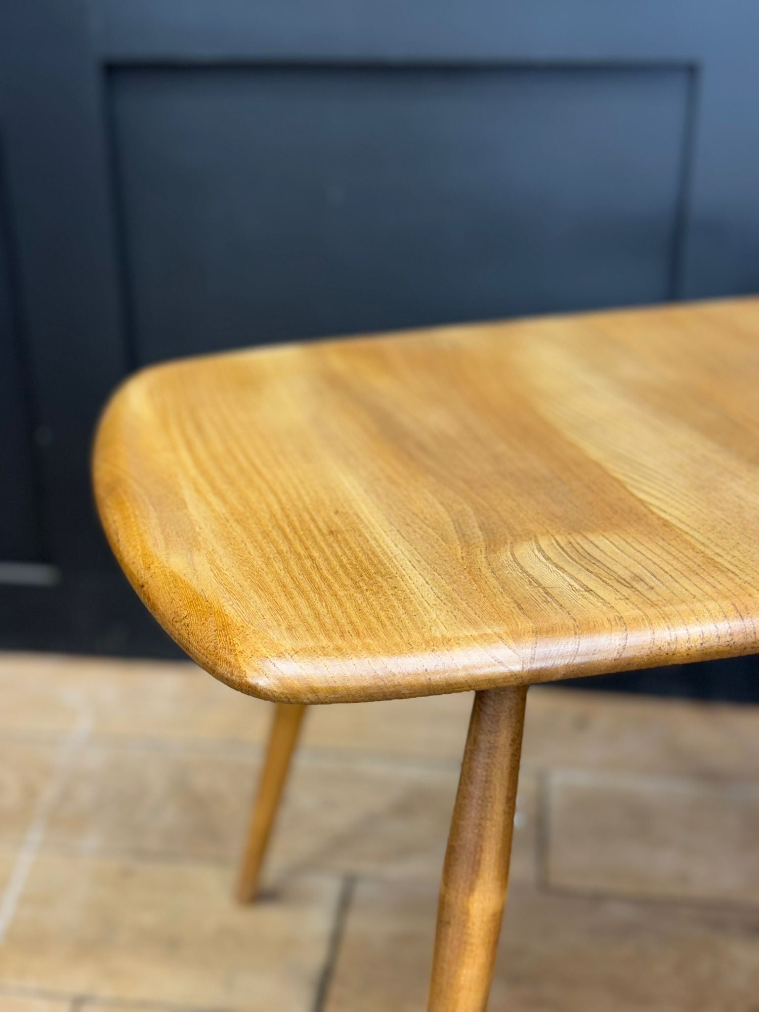 Light colored elm vintage ercol model 213 coffee table with rounded edges and tapered legs professionally laser stripped