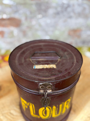 Vintage brown galvanised metal flour bin with yellow flour label and small latch for storage use