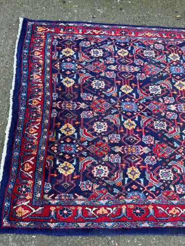 Vintage handmade wool rug with navy blue field and intricate floral geometric patterns arak sourak sarough 300cm x 133cm