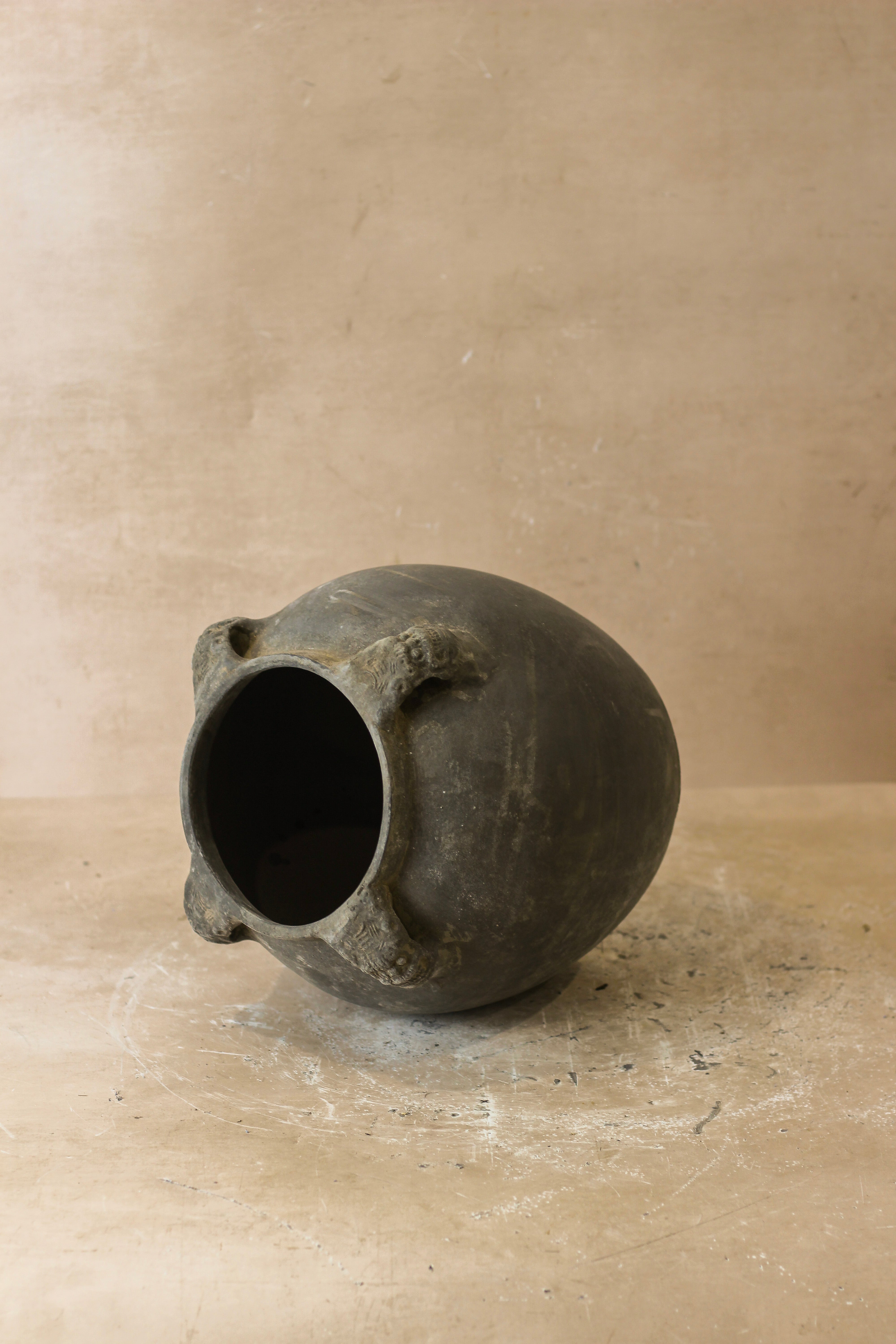 Dark gray ceramic vintage lion ears pot with three rough textured handles perfect for stylish storage