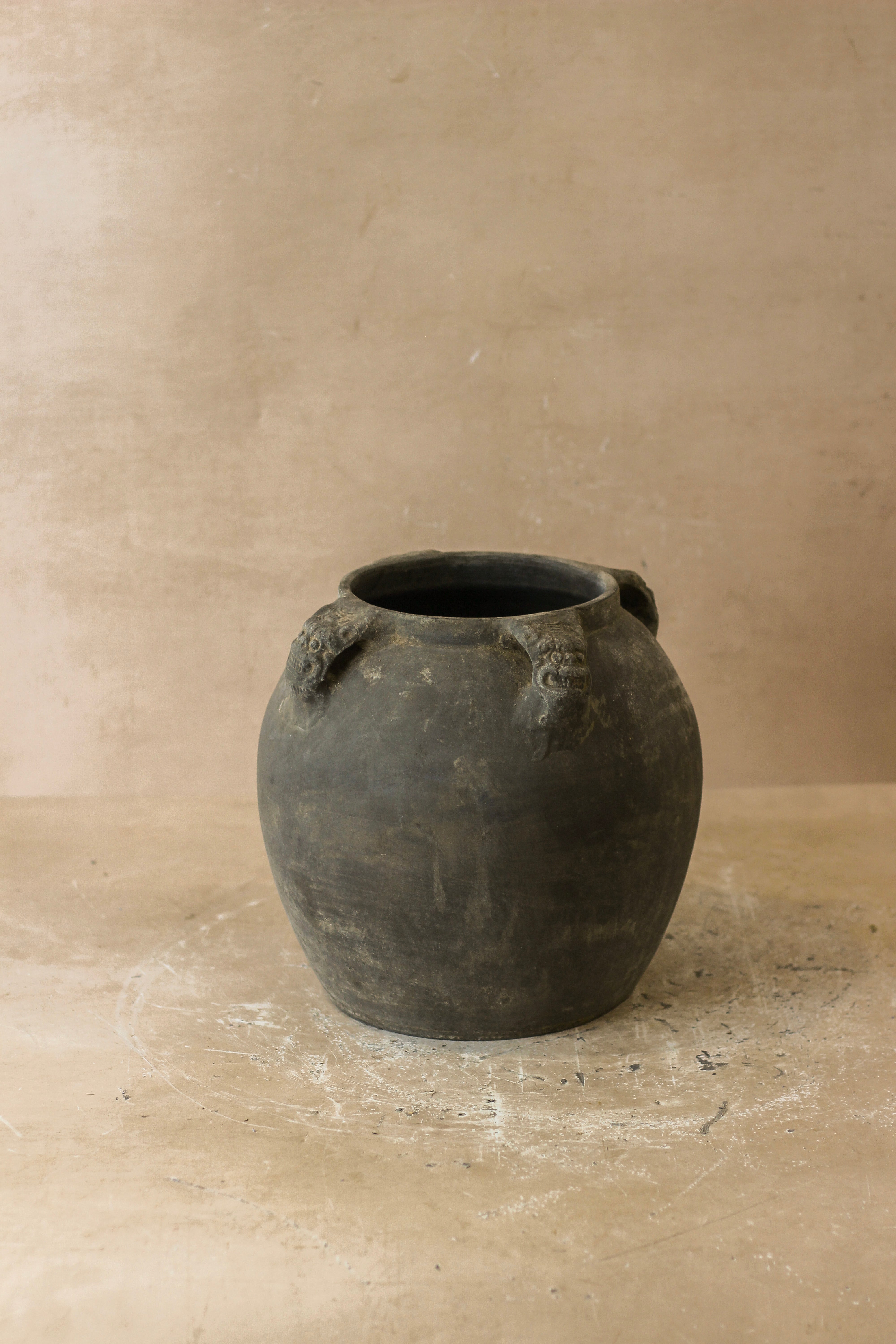 Dark gray ceramic vintage lion ears pot with two sculpted handles perfect for decorative use