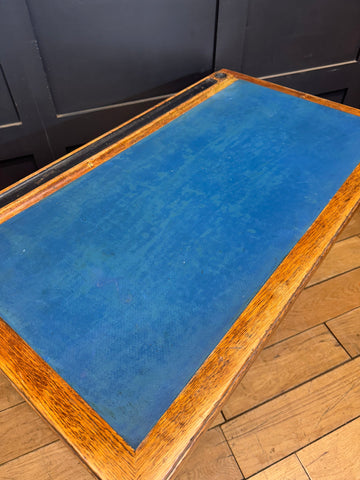 Vintage oak desk with vibrant blue leather top and visible wood grain edges perfect for desk office use