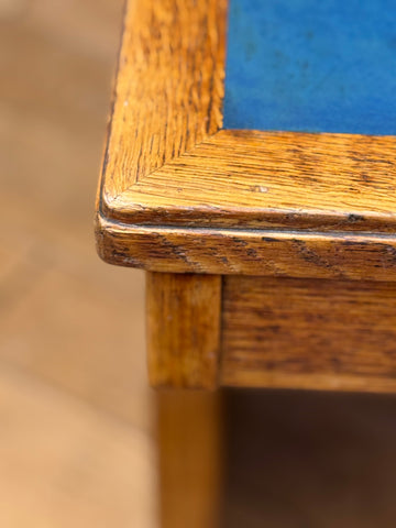 A vintage oak desk corner with a warm amber finish and visible wood grain perfect for office use