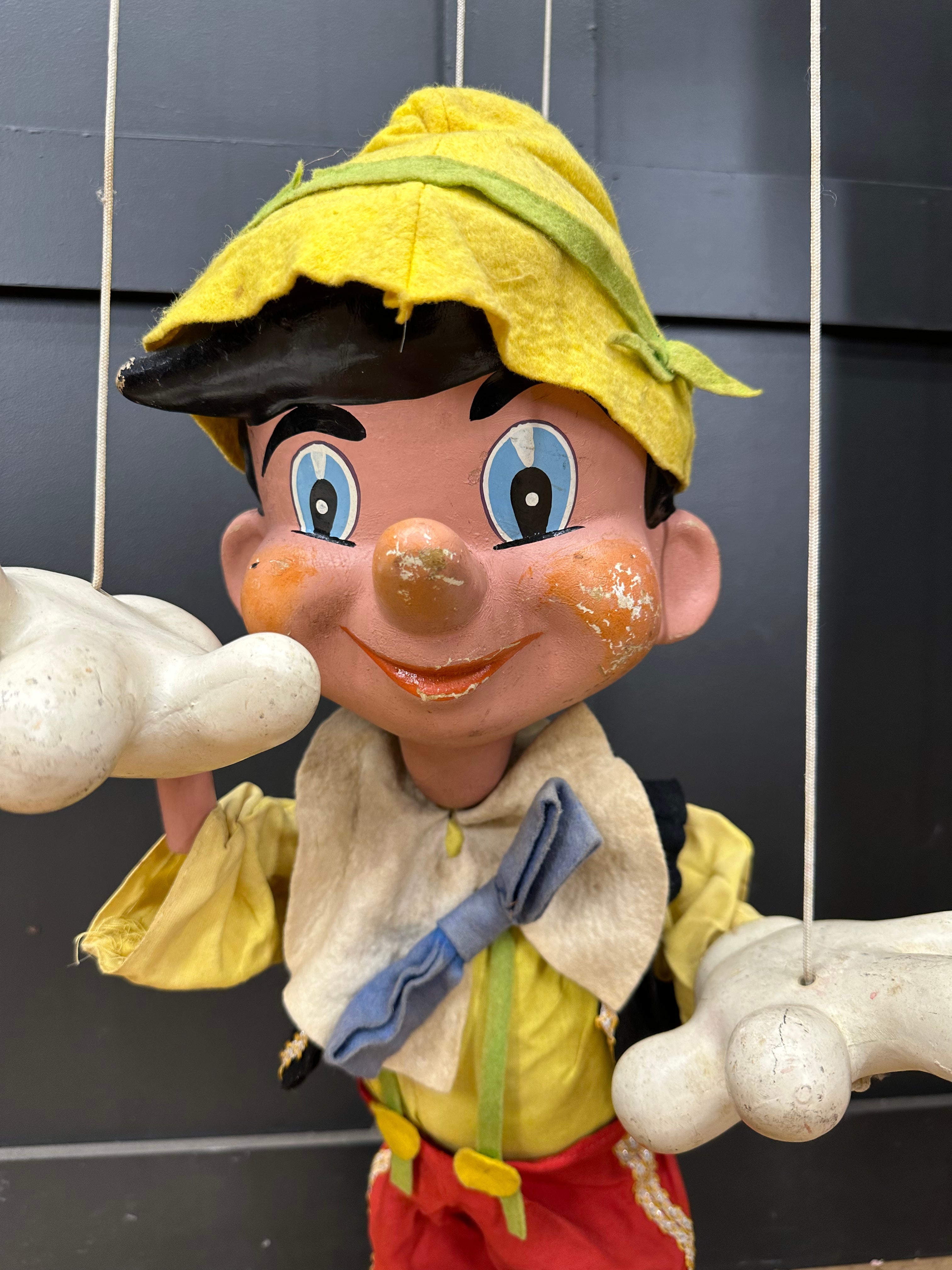Vintage pelham puppets wooden pinocchio marionette with yellow hat blue eyes and red pants collectible rare puppet