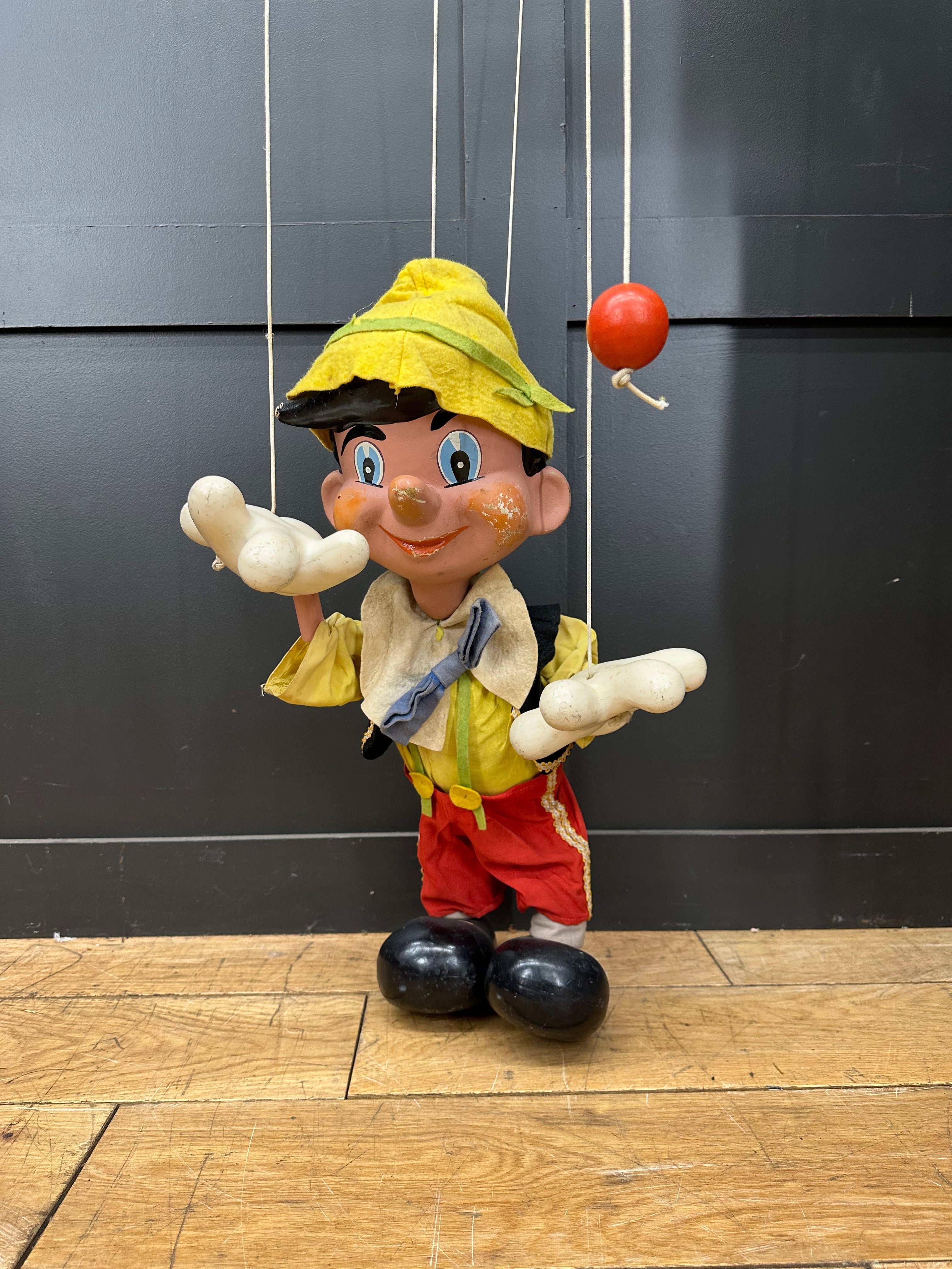 Vintage pelham puppets wooden pinocchio marionette in yellow hat jacket red pants holding blue ribbon collectible rare