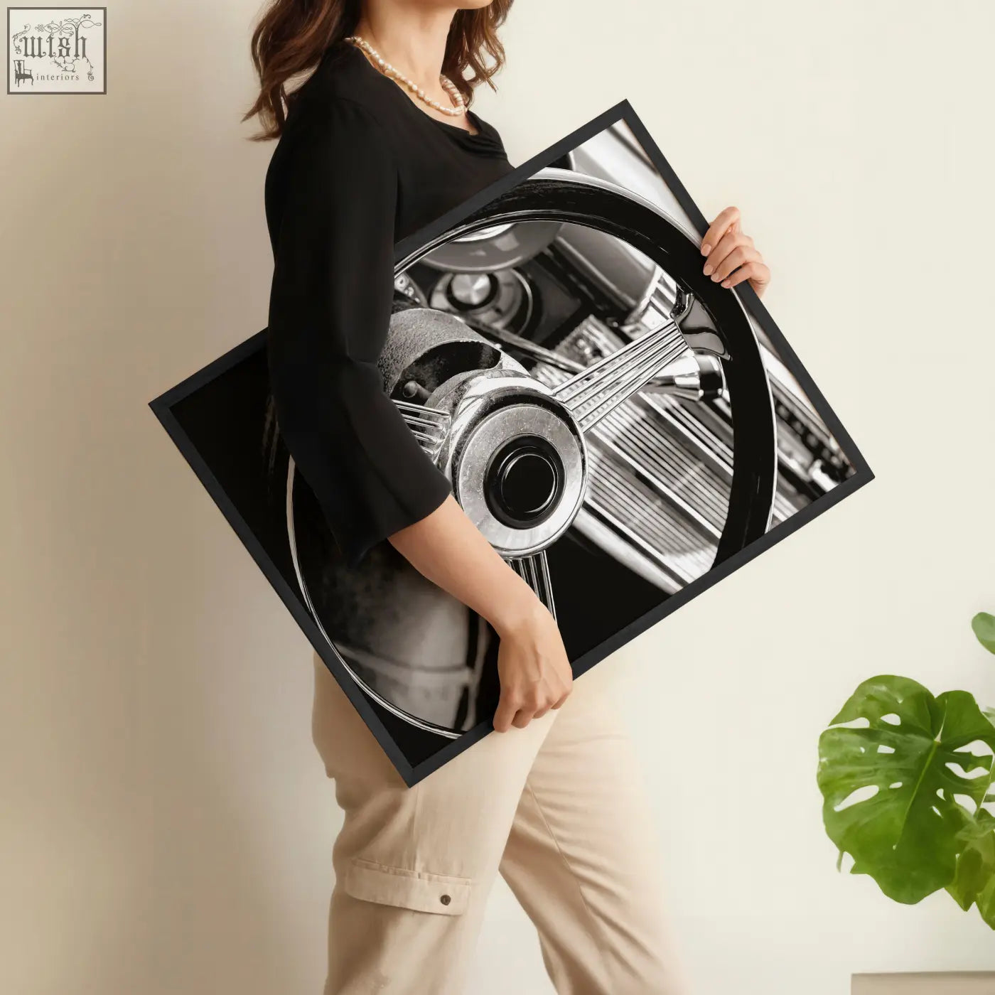 Black-framed canvas print of vintage posters wall art featuring classic car steering wheel black and white photo