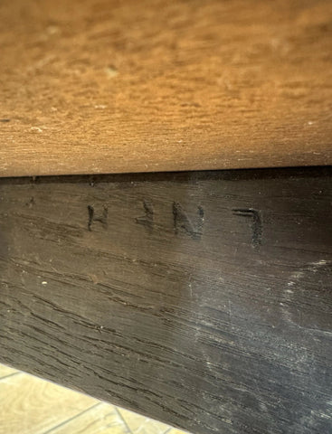 Dark wood drawer front with engraved hunt mark on vintage mid century lner railway stool seating seat