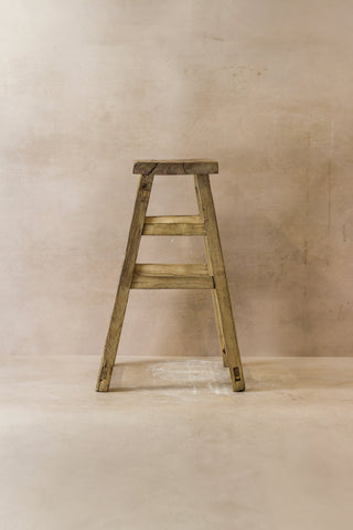 Vintage rustic elm wood stool medium with weathered light brown finish and visible elm wood grain