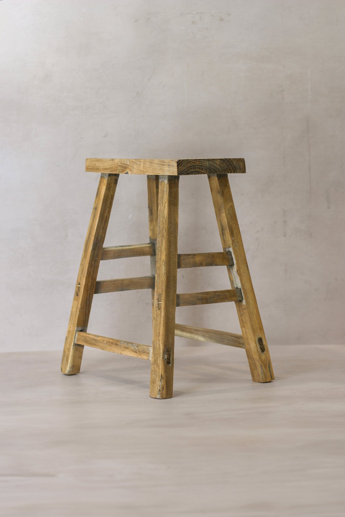 Vintage rustic elm wood stool medium with square seat and angled legs showing natural elm wood grain finish