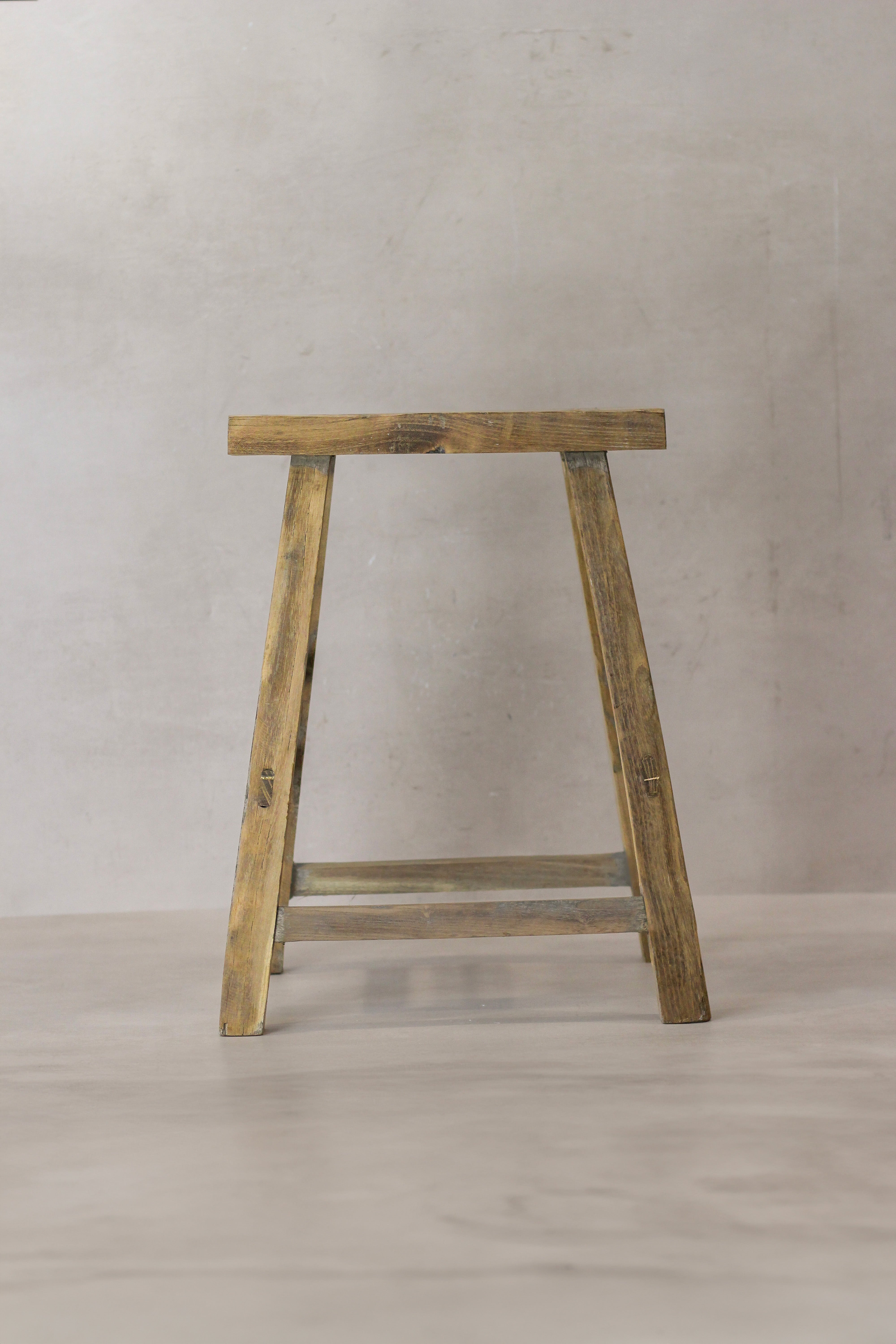 Vintage rustic elm wood stool medium with weathered finish and sturdy a-frame legs for rustic decor seating