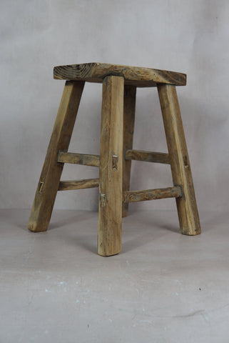 Vintage rustic elm wood stool with weathered natural finish and sturdy slightly tapered legs in elm wood