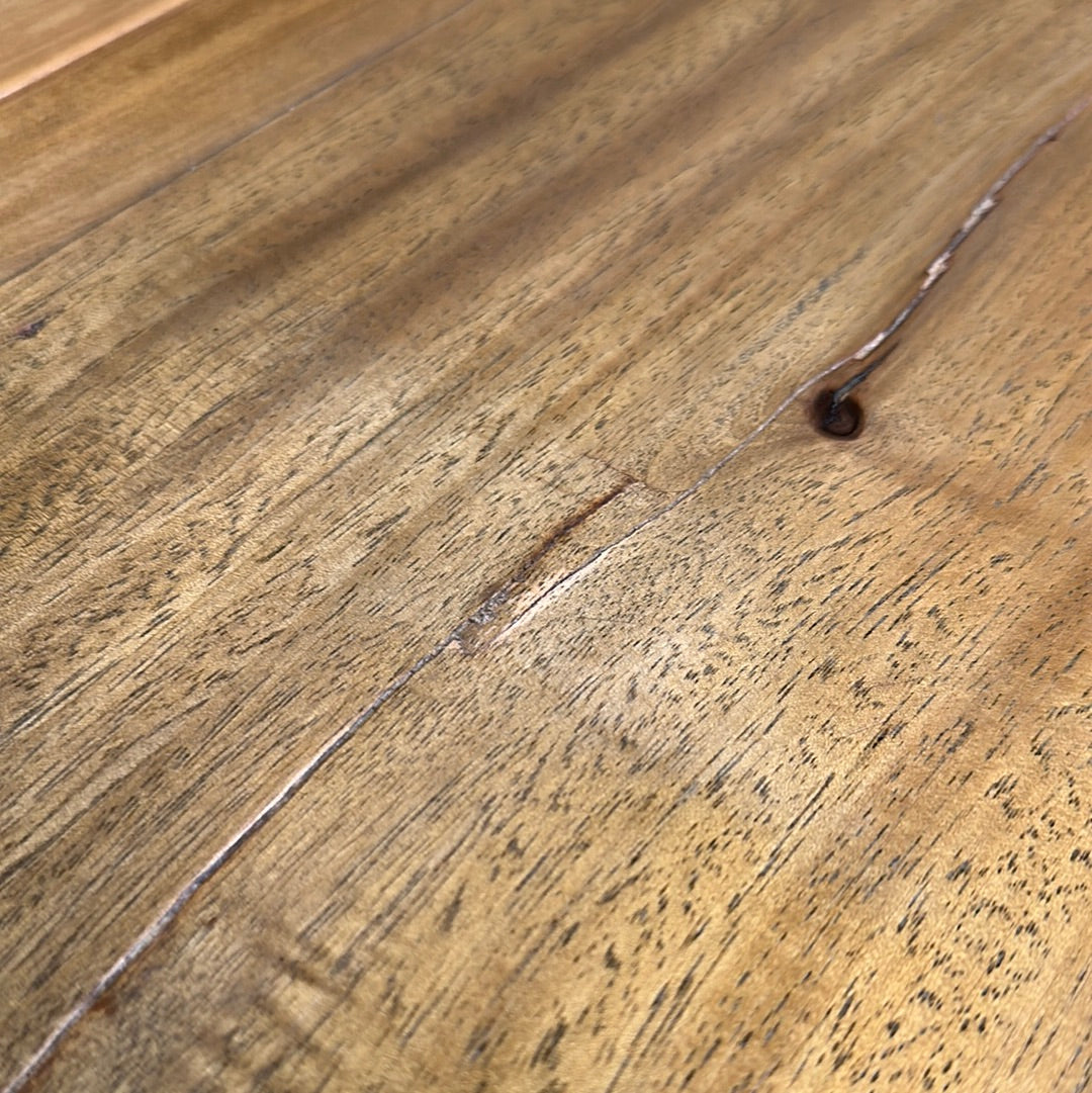 Warm-toned wooden floor with visible grain and small nail in vintage dowry chest sideboard surface