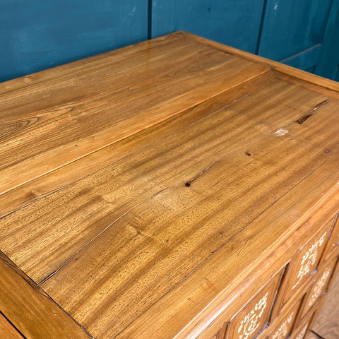 Vintage warm polished wooden dowry chest with smooth finish and intricate inlaid decorative front panels