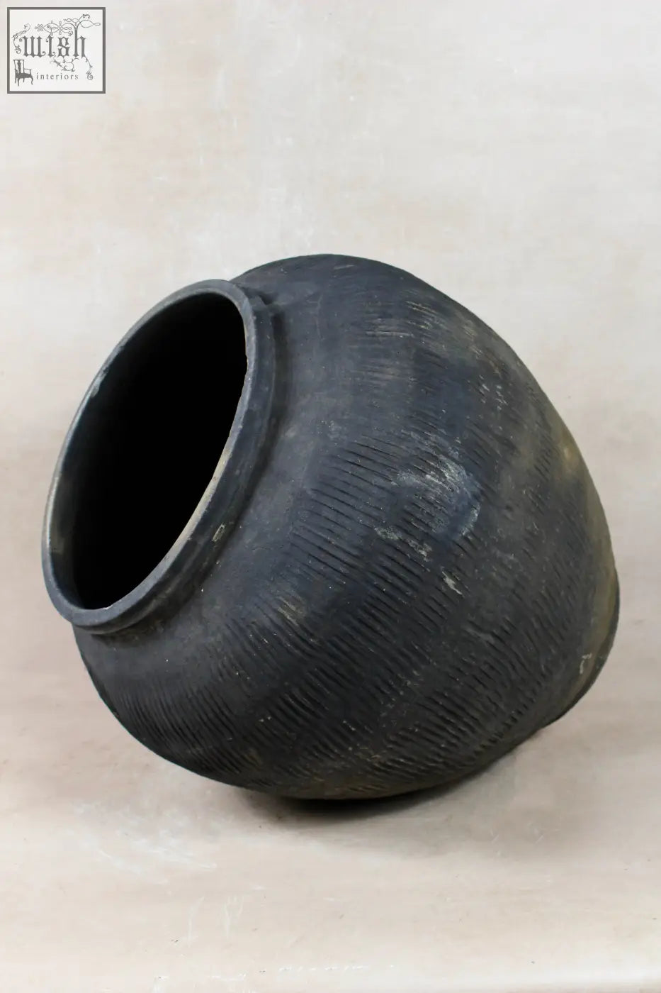 A matte black handcrafted ceramic jar with subtle horizontal ridges and wide opening vintage textured grey pot vt18