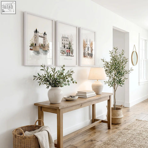 Light wood console table with clean design and visible grain showcasing vintage travel posters art wintertime in london set